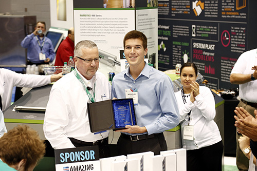 2014 ASCO Numatics Engineering Scholarship winner Nicholas Aerni accepts his award at Pack Expo. 