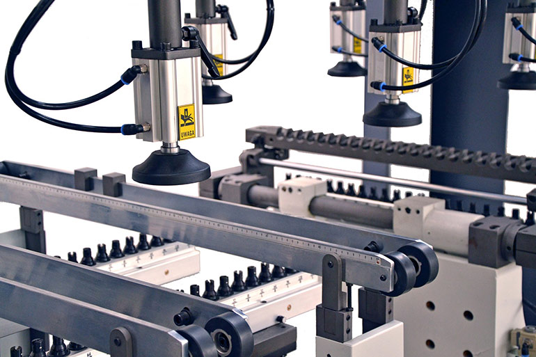 Industrial automation applications often employ material handling solutions like pick and place equipment. The automated process pictured here features pneumatic actuators equipped with vacuum cups that can grip and move delicate items like glass.