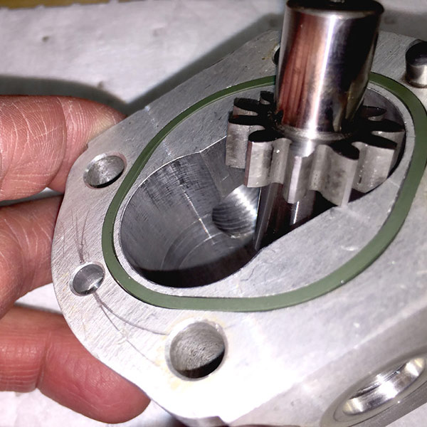 Oil contamination can damage internal components, like the damage seen on this gear pump. The increased friction and wear between the pump’s rotating group against its housing or wear components can cause localized noise, chatter, and vibration above and beyond the usual noise generated by pumps and other components. Image courtesy of CD Industrial Group/LunchBox Sessions