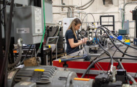 Kathryn Baisley, Test Engineer for the Fluid Power Institute at Milwaukee School of Engineering, works on a test rig for Hallite seals.