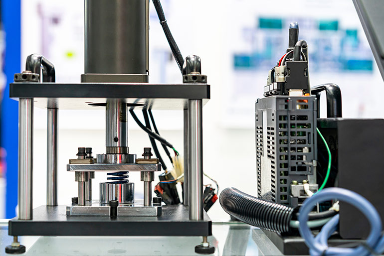 Machines like hydraulic presses, like this one being tested here, require the safety and accuracy that sensing technology can provide. | Courtesy of Adobe Stock