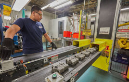 Here, a QCC employee runs a line manufacturing Danfoss legacy products.