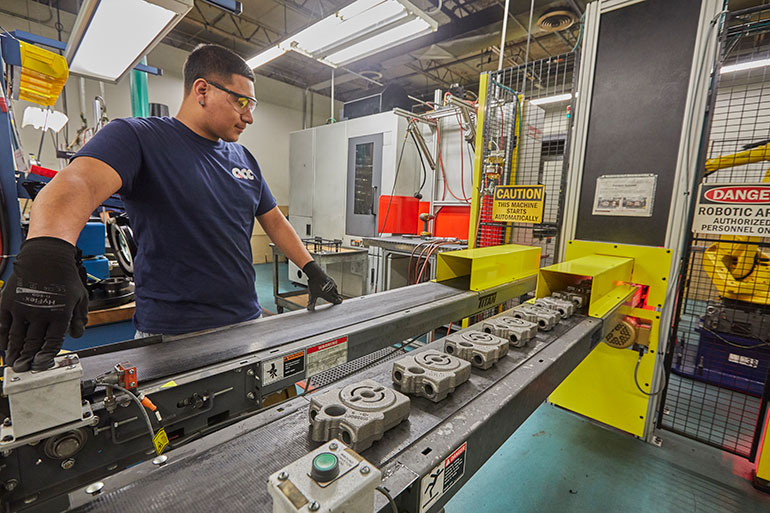 Here, a QCC employee runs a line manufacturing Danfoss legacy products.
