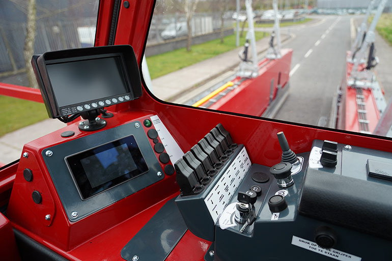 A panoramic cabin provides high visibility for safe operation and transport of loads.