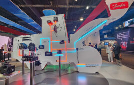 Danfoss' CONEXPO booth was hard to miss with the giant cutout board, highlighting its hydraulics technologies on side, and electronics on the other (below), and how they work together in a complete system.