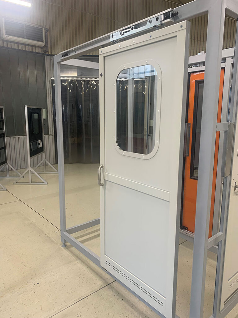 Lightweight, compound aluminum separating and passage doors in flat and bent designs are part of Metal 99’s product portfolio for European railway companies. Image courtesy Metal 99 Ltd., Hungary