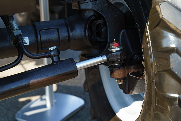 Traditional “road-safe” steer-by-wire systems typically retain a physical link — mechanical or hydraulic — between the operator and the steering axle.
