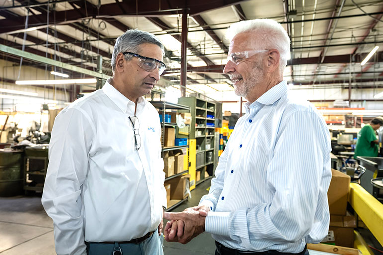 Rahul Deshmukh, left, has succeeded Mark Winter, right, as CEO of Alkon Corp.