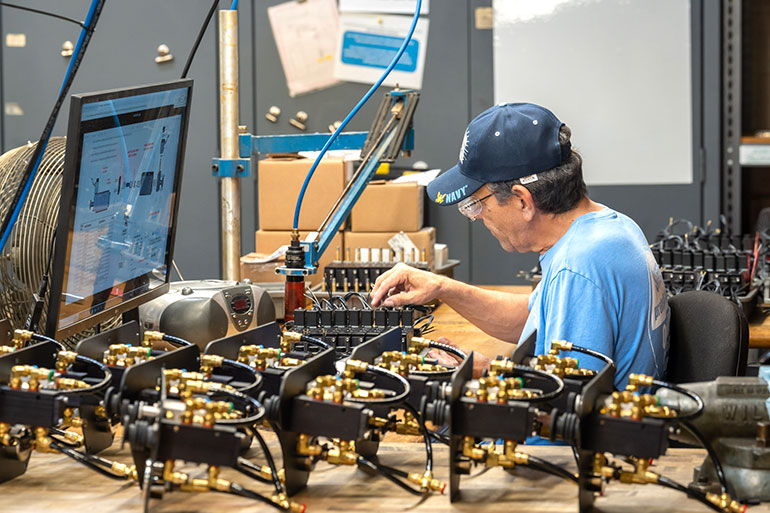 Alkon team member Jesus Torres assembles AirBOSS pneumatic control components.